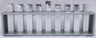 Emanuel menorah with nine square silver branches standing inside an open rectangular silver frame