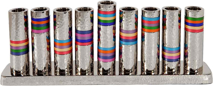 Emanuel menorah of nine hammered silver cylinders with multicolor ring bands on a hammered base