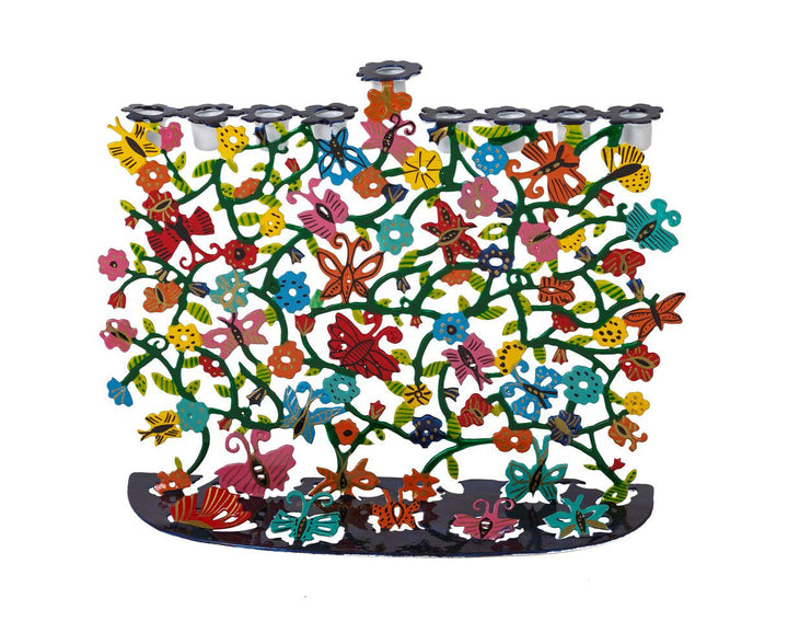 Emanuel laser cut menorah panel filled with hand-painted flowers and leaves on a dark base