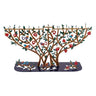 Laser cut Emanuel pomegranate tree menorah, hand-painted with red fruit, birds and blossoms on a dark base