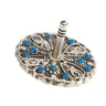 Round silver tone Emanuel dreidel with blue stones and Hebrew letters around a striped center post