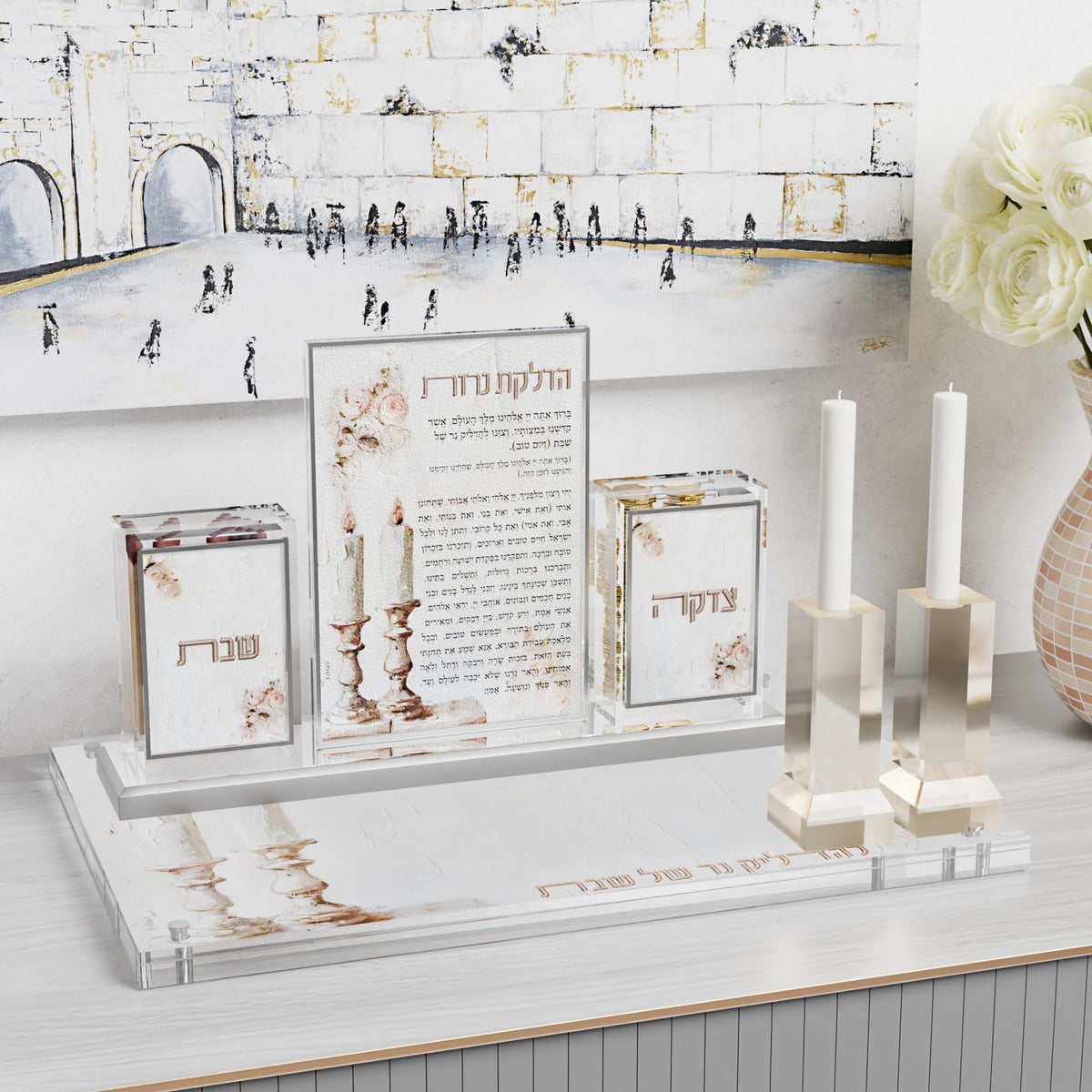 Set on a tray with lucite candlesticks, a Kosel painting on the wall behind