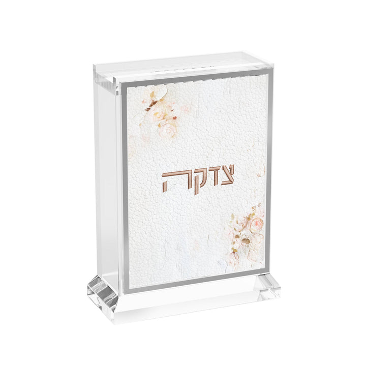 Blush Rose tzedakah box, white leather panel with pink roses and Tzedakah lettering in clear lucite