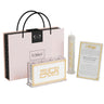 Classic Gold family Havdalah set: besamim holder, braided candle and card in front of its pink gift box