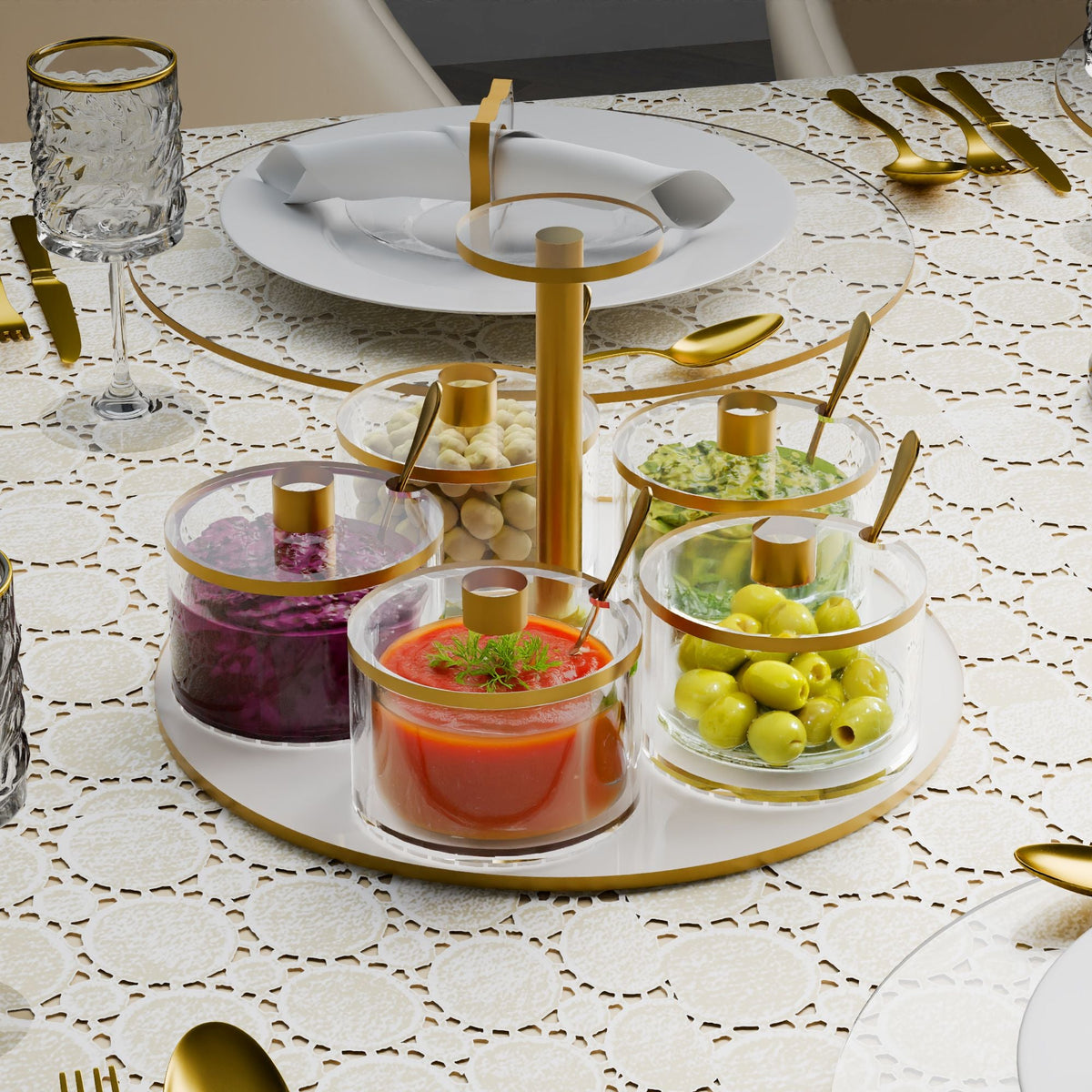 Five-dish server on a lace tablecloth filled with olives, red cabbage, dips and chickpeas