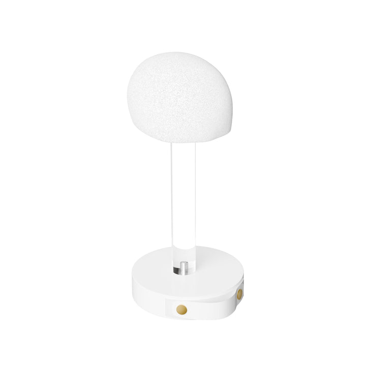 Wig head stand angled to show the clear column and the pull tab on the base compartment