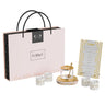 Gold Honeycomb Rosh Hashanah set: honey dish with dipper, Shana Tova napkin rings and simanim card by a gift bag