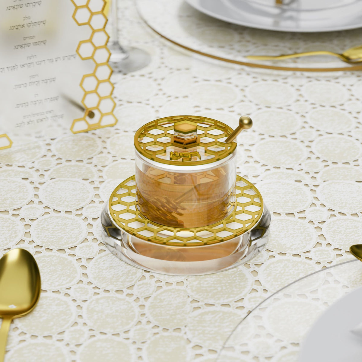 Gold honeycomb honey jar filled with honey on a lace tablecloth at a Rosh Hashanah setting