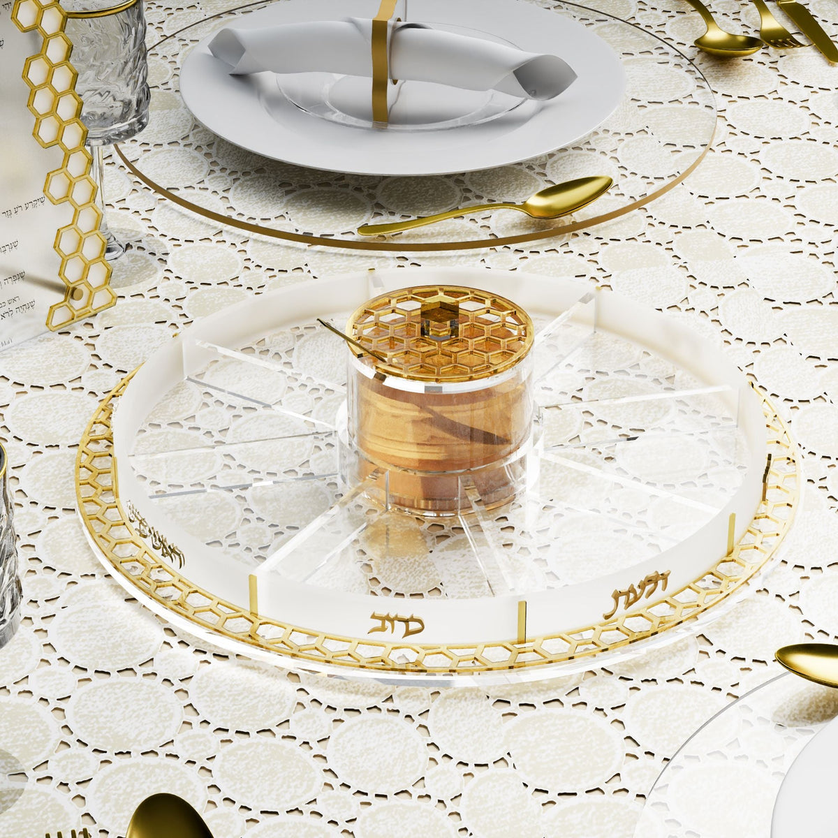 Empty gold simanim tray with honey in the center dish on a lace-covered table