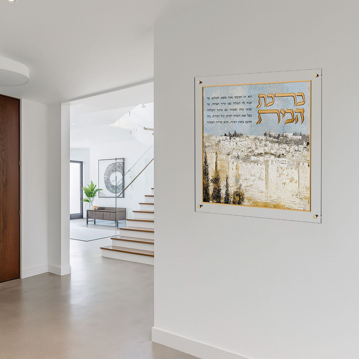 Birchas Habayis hung on a white entryway wall across from a staircase