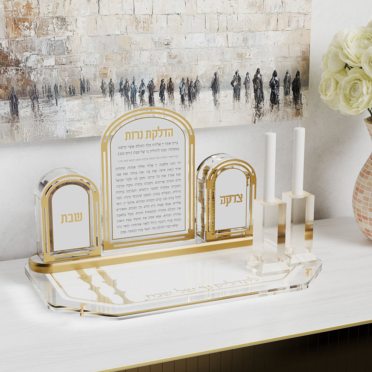 Gold tray holding an arched candle-lighting set and candlesticks below a Kosel painting