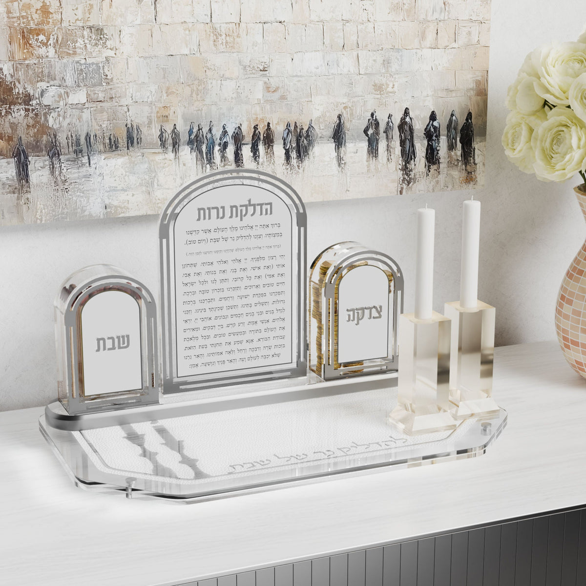 Silver tray with an arched candle-lighting set and candlesticks against a Kosel painting