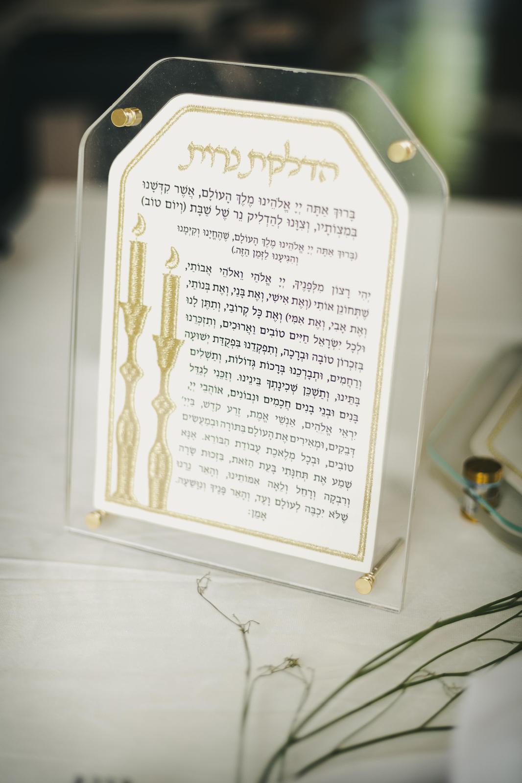 Close view of the gold card standing on a table, gold legs visible at the base
