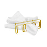 Gold Pesach napkin ring shaped as Hebrew letters around a folded white cloth napkin
