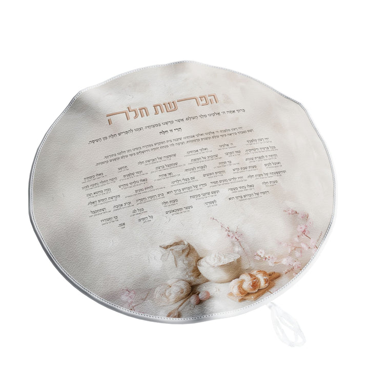 Round Hafrashas Challah cover with Hebrew and Yiddish tefillah, pink blossoms and dough, drawstring below