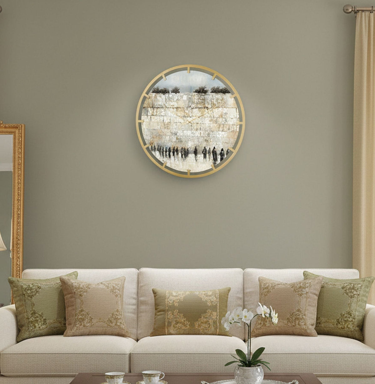 Serene Kosel clock hanging above a cream sofa with green and gold cushions, showing its size on the wall