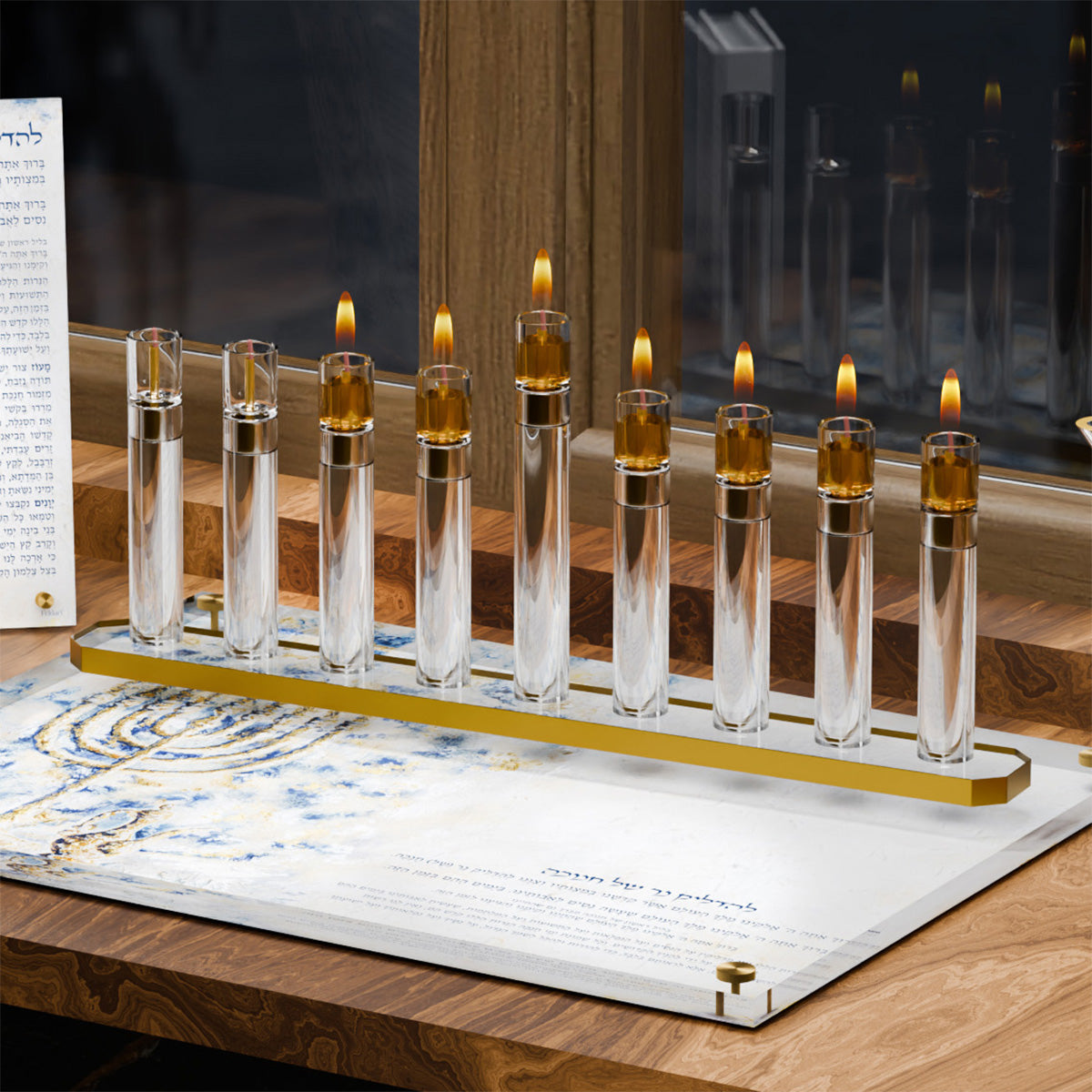 Close view of the gold tube menorah lit on a Splash of Gold tray