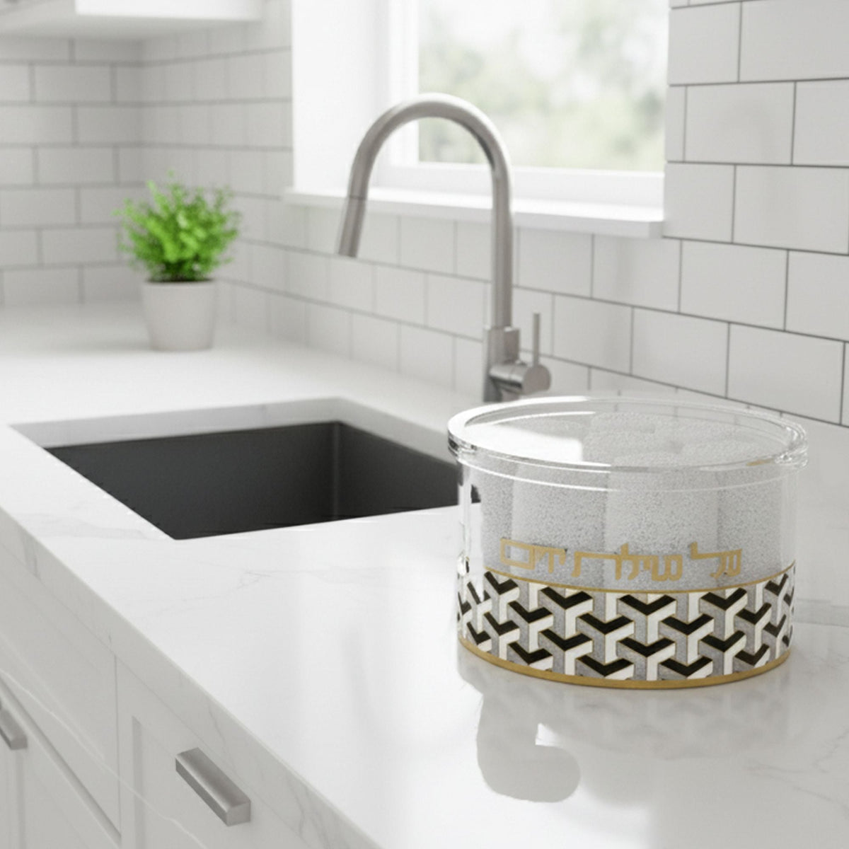 Towel box of rolled white towels beside a kitchen sink on a white quartz counter
