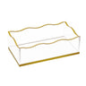 Wave guest towel holder, clear rectangular caddy with wavy gold rim and gold base, angled view