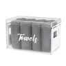 Towel box filled with grey towels, showing white pearl side panels and handle cutouts