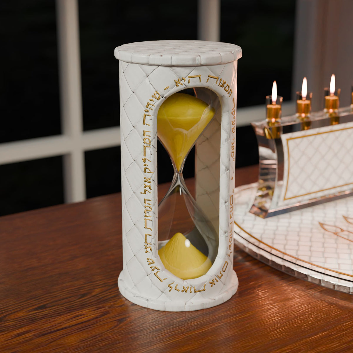 Gold sand timer on a wooden table beside a lit menorah and matching tray