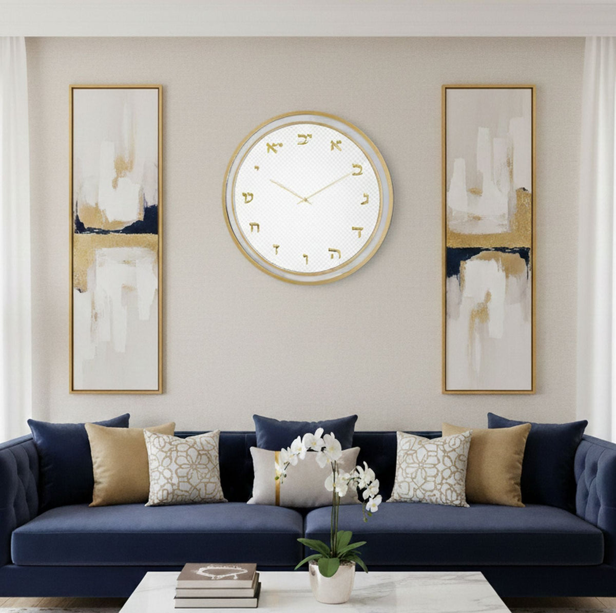 Gold Hebrew wall clock hung above a navy sofa between two abstract gold art panels