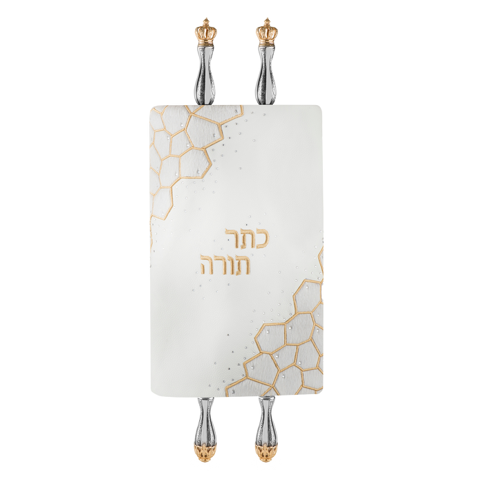 White Torah mantle with gold-tone Hebrew embroidery and geometric accents — on Torah scroll