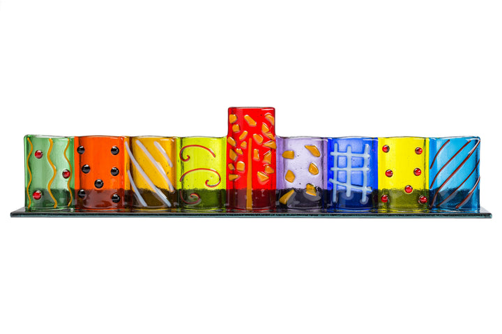 Row of colorful patterned glass tealight holders