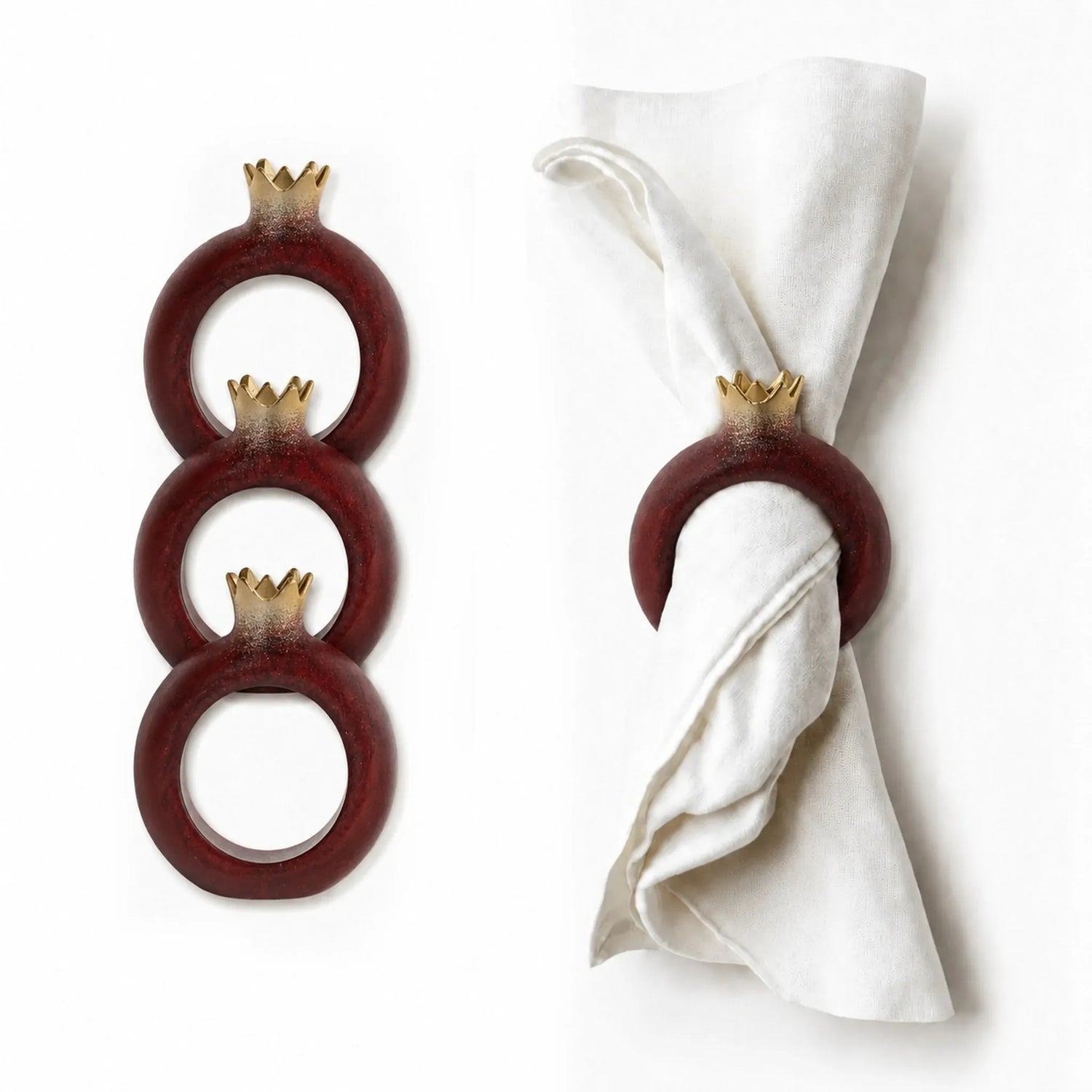 Gold-accent pomegranate napkin rings arranged at a holiday place setting