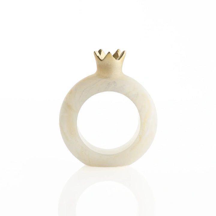 Single cream-and-gold resin pomegranate napkin ring on a white background