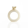Single cream-and-gold resin pomegranate napkin ring on a white background
