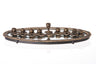 Antiqued gold tone linked menorah on an oval mirror tray