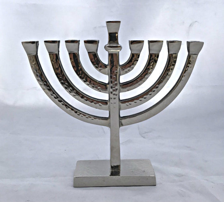 Hammered silver tone menorah with square cups on a square base