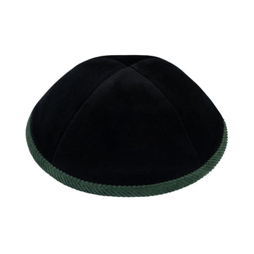 Front view of iKippah black velvet kippah with forest-green corduroy rim and four-panel construction