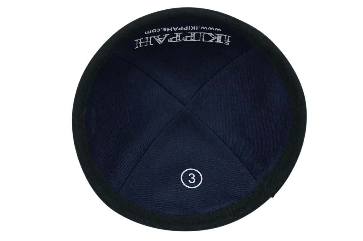 Interior of iKippah forest green wool kippah showing lining, size 3 mark, and iKippah branding