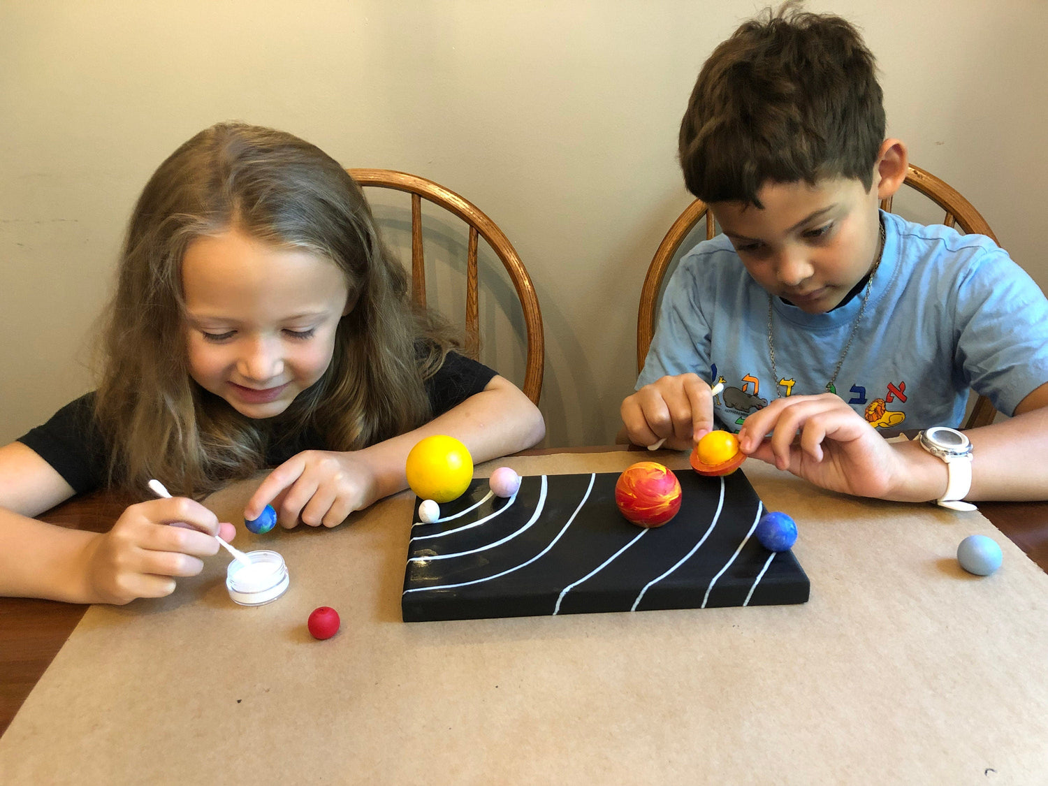 Solar system menorah kit — wooden planet pieces forming an outer space hanukkiah | Judaica Square Lakewood (view 5)