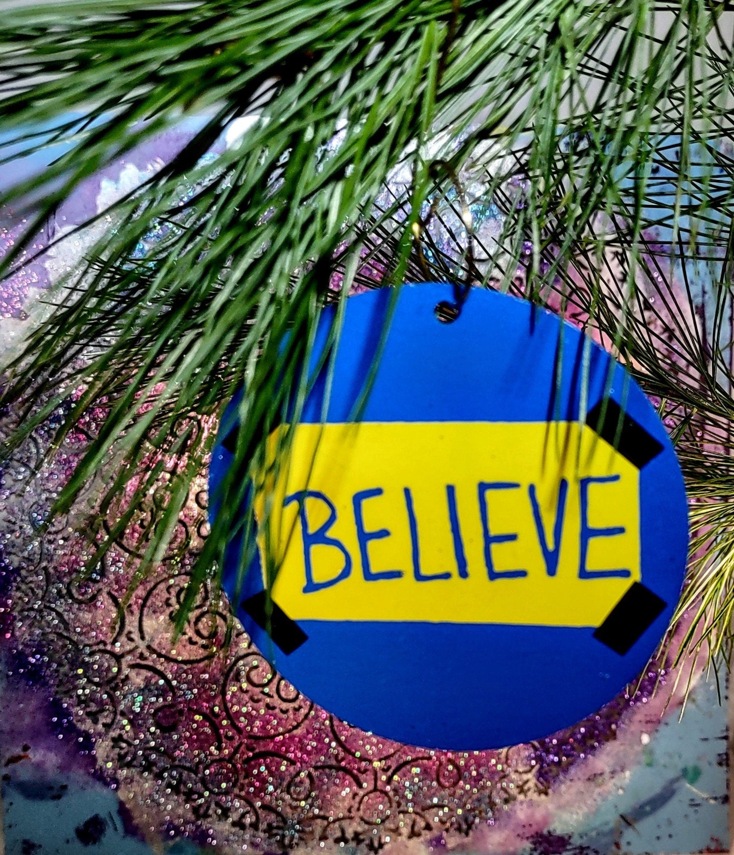 Believe ornament — Ted Lasso wood circle with vinyl lettering and gold spiral hook | Judaica Square Lakewood (view 2)