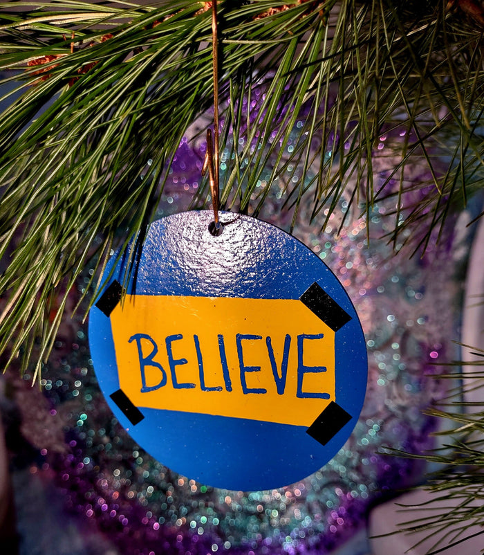Believe ornament — Ted Lasso wood circle with vinyl lettering and gold spiral hook | Judaica Square Lakewood