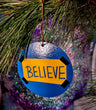 Believe ornament — Ted Lasso wood circle with vinyl lettering and gold spiral hook | Judaica Square Lakewood