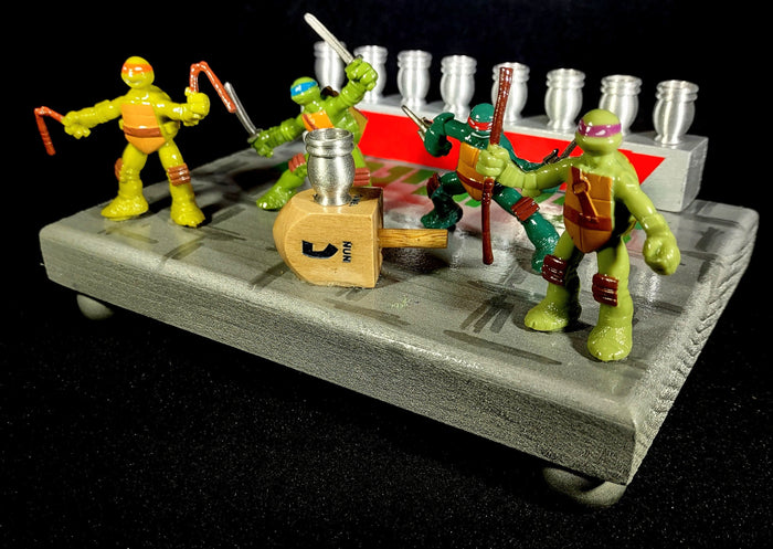 TMNT Menorah — four ninja turtle figures with Hebrew lettering and aluminum cups | Judaica Square Lakewood
