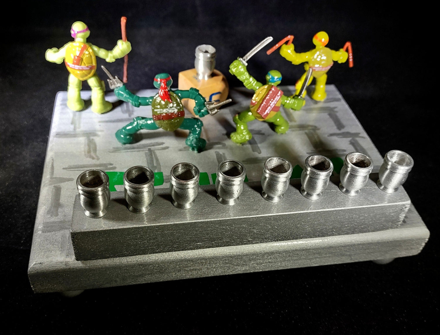 TMNT Menorah — four ninja turtle figures with Hebrew lettering and aluminum cups | Judaica Square Lakewood (view 3)