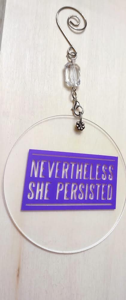Feminist ornament reading Nevertheless She Persisted in painted wood | Judaica Square Lakewood (view 8)