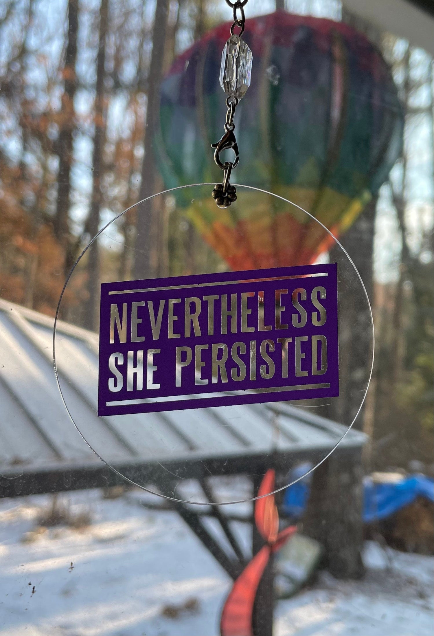 Feminist ornament reading Nevertheless She Persisted in painted wood | Judaica Square Lakewood (view 9)