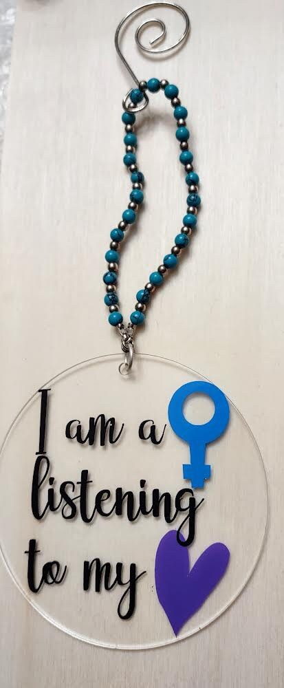 Feminist ornament reading Nevertheless She Persisted in painted wood | Judaica Square Lakewood (view 4)