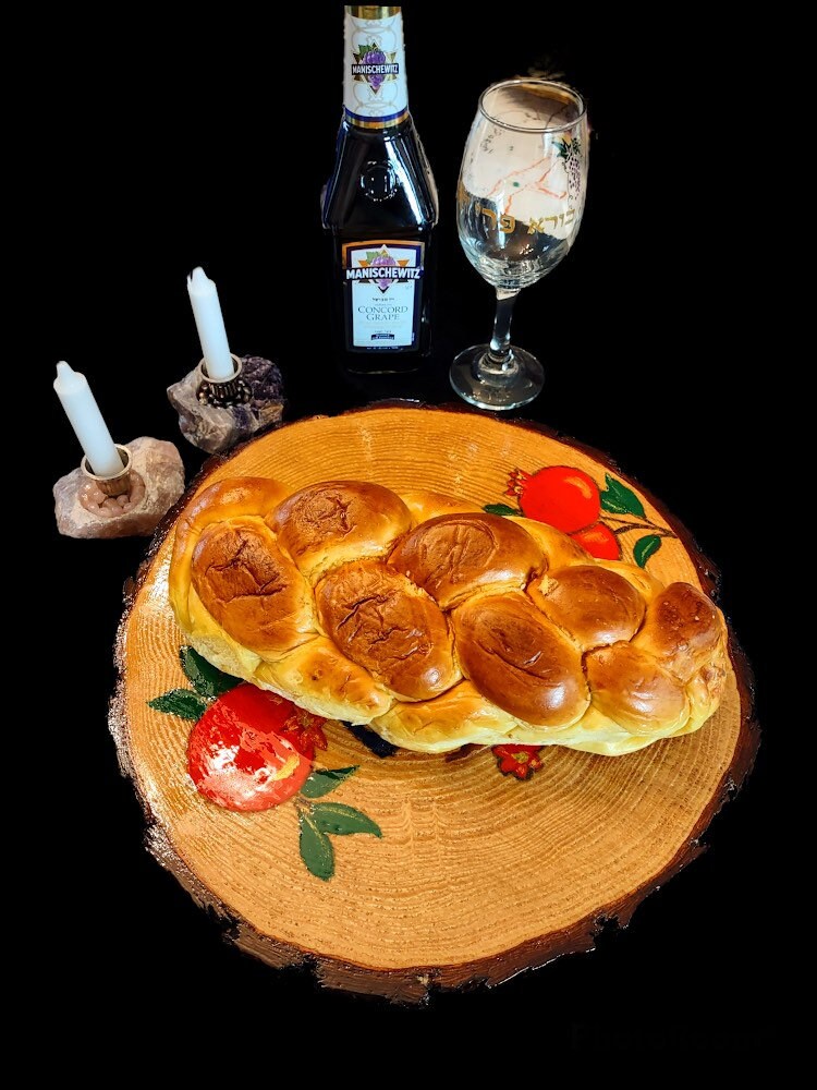 Pomegranate challah board — live edge tree slice hand-painted with fruit and Hebrew script | Judaica Square Lakewood (view 2)