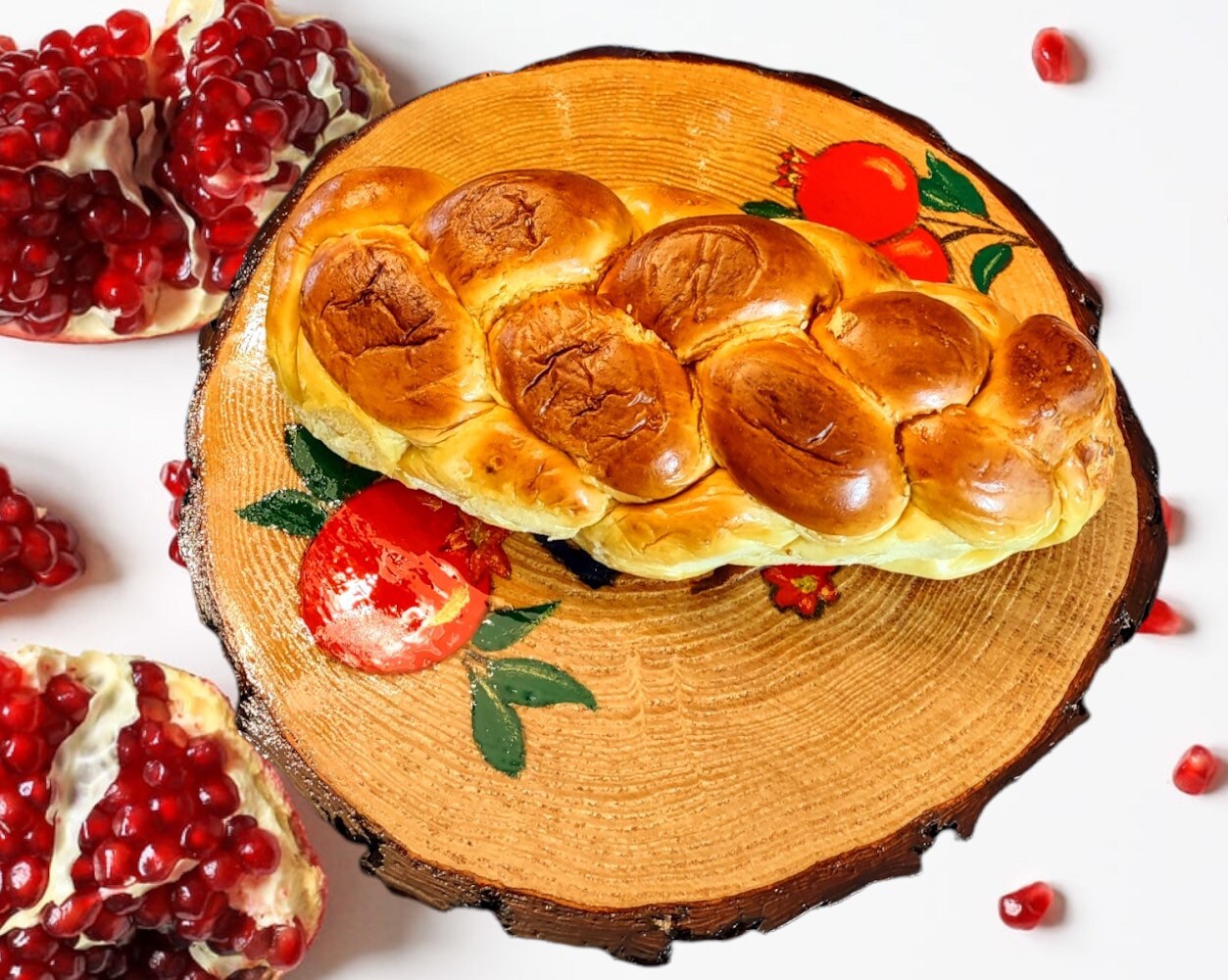 Pomegranate challah board — live edge tree slice hand-painted with fruit and Hebrew script | Judaica Square Lakewood (view 3)