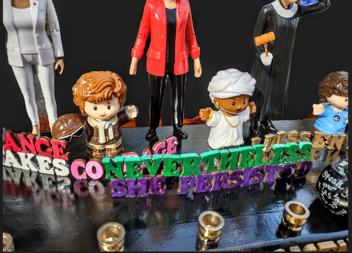 Feminist menorah — nine women figures with painted quote letters and brass cups | Judaica Square Lakewood (view 5)