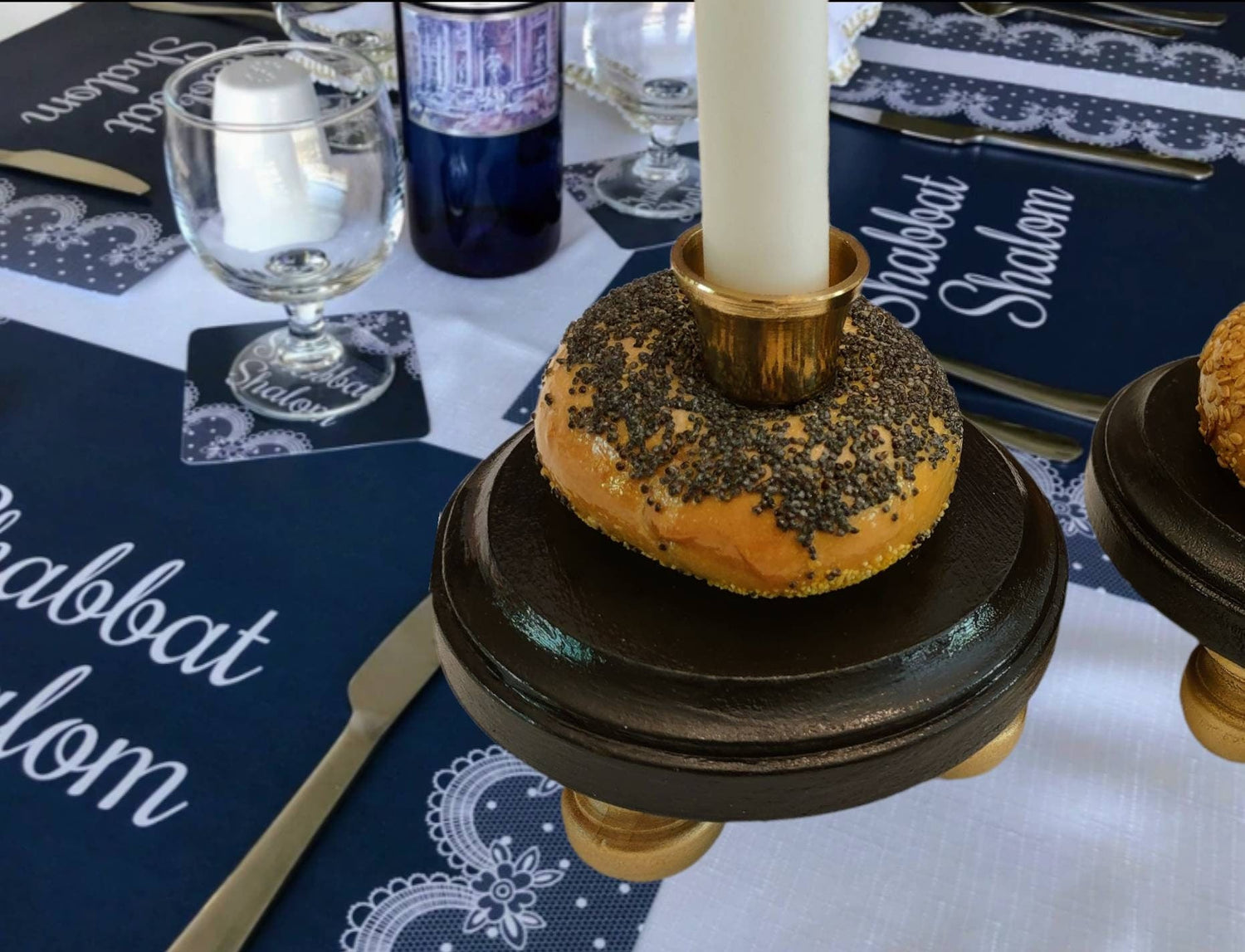 Bagel Shabbat candlesticks — shellacked real bagels on painted wood bases with brass candle cups | Judaica Square La (view 3)