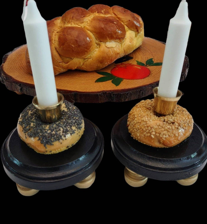 Bagel Shabbat candlesticks — shellacked real bagels on painted wood bases with brass candle cups | Judaica Square Lakewood