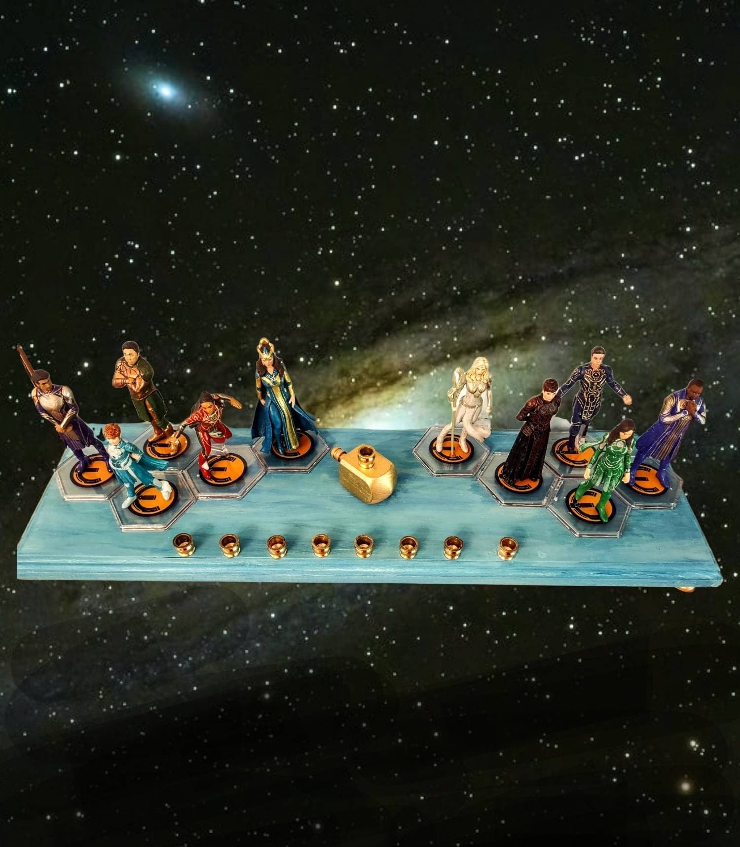 Eternals Menorah — row of superhero figures on a stained wood base with candle cups | Judaica Square Lakewood (view 2)